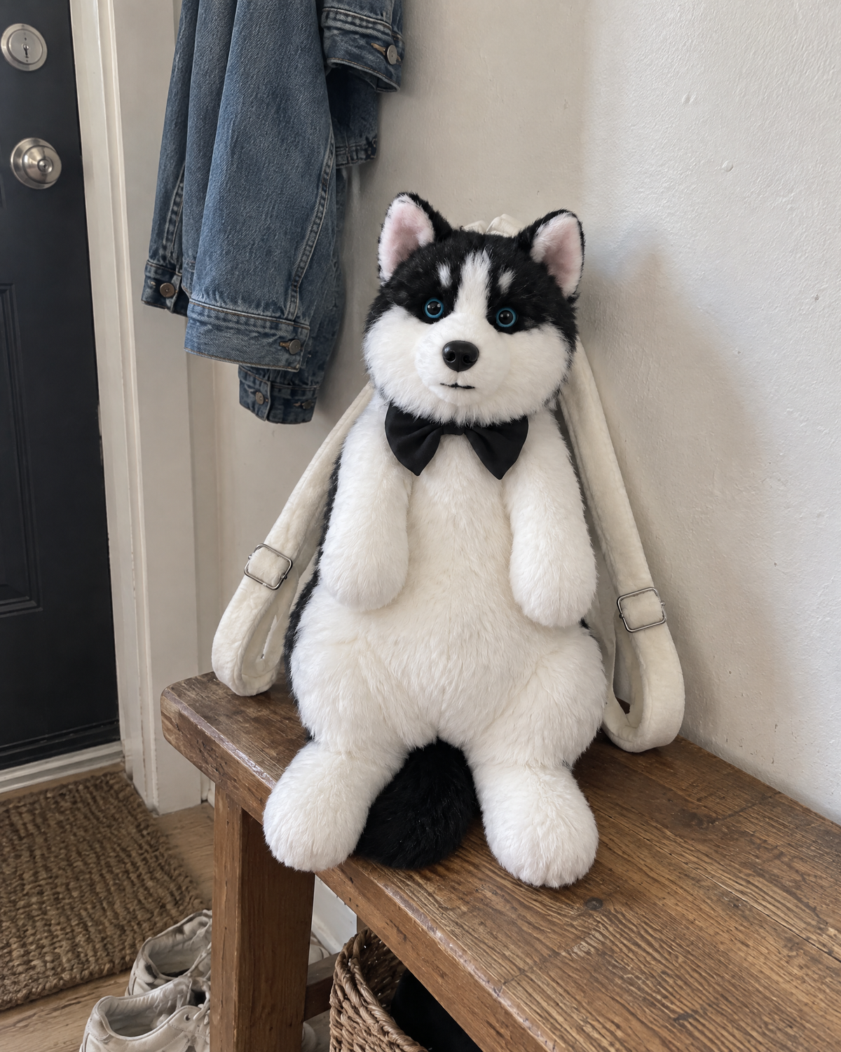 Husky | Plush backpack on an entryway bench
